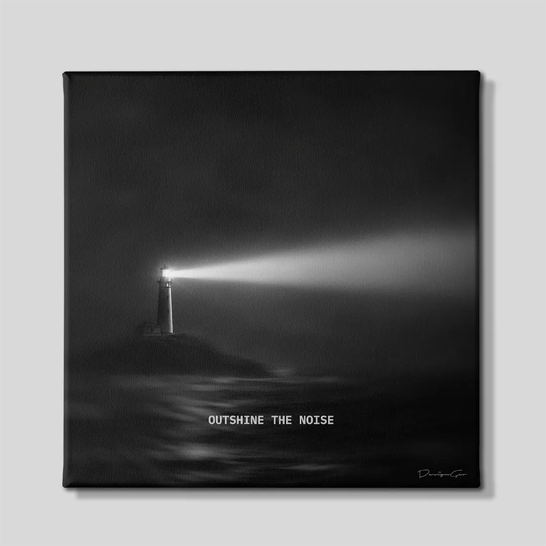 Black and white square canvas art featuring a lighthouse beaming light over dark ocean with quote Outshine The Noise 0.75 inch thin wrap