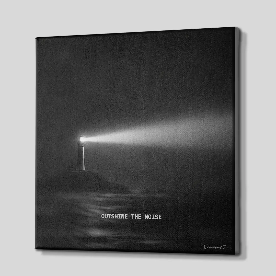Side perspective view of black and white square canvas wall art showing lighthouse artwork with black gallery wrapped edge 0.75 inch thin wrap