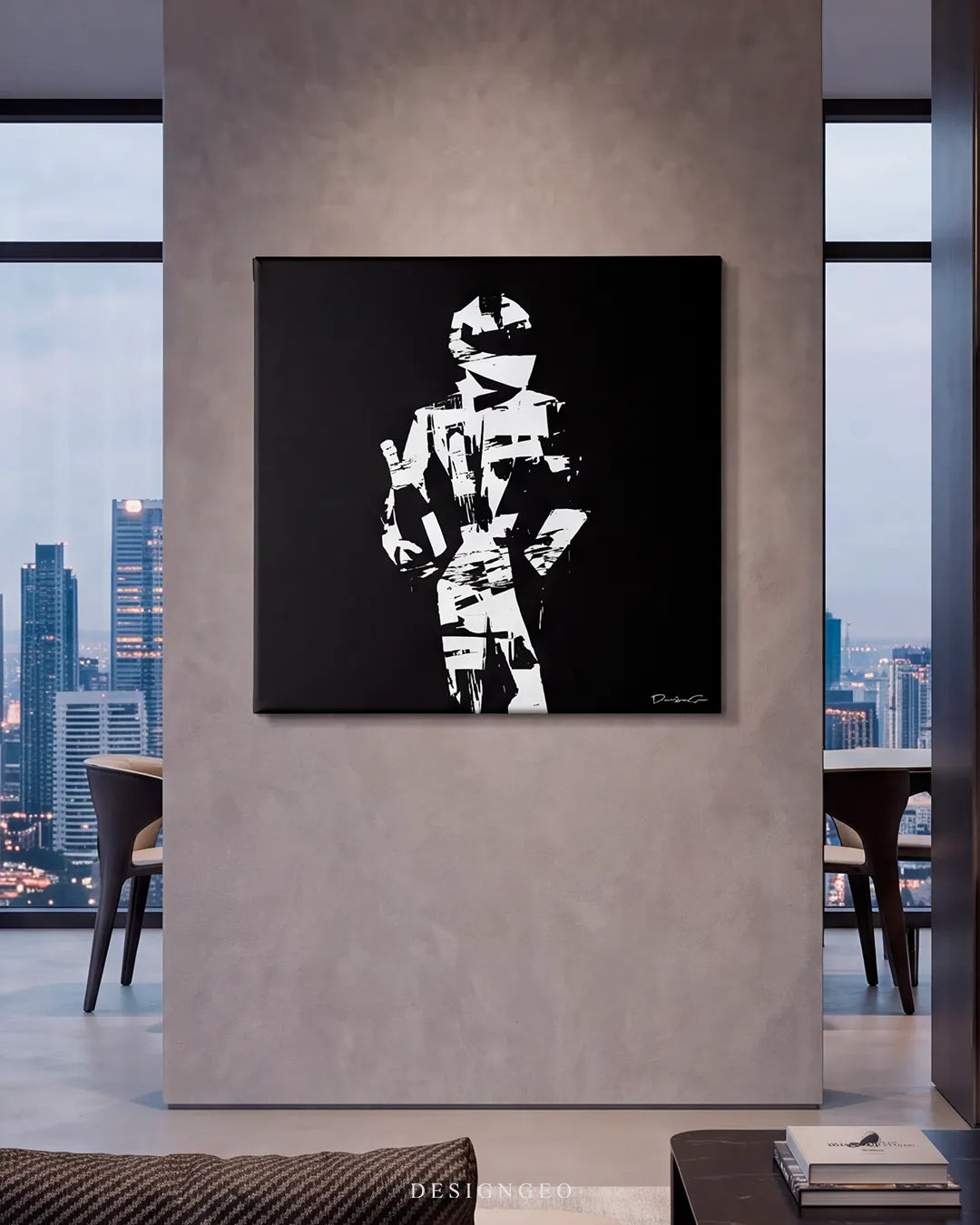 Modern luxury living room setup featuring the square black and white minimalist racing driver canvas art mounted on a gray concrete wall overlooking a city skyline