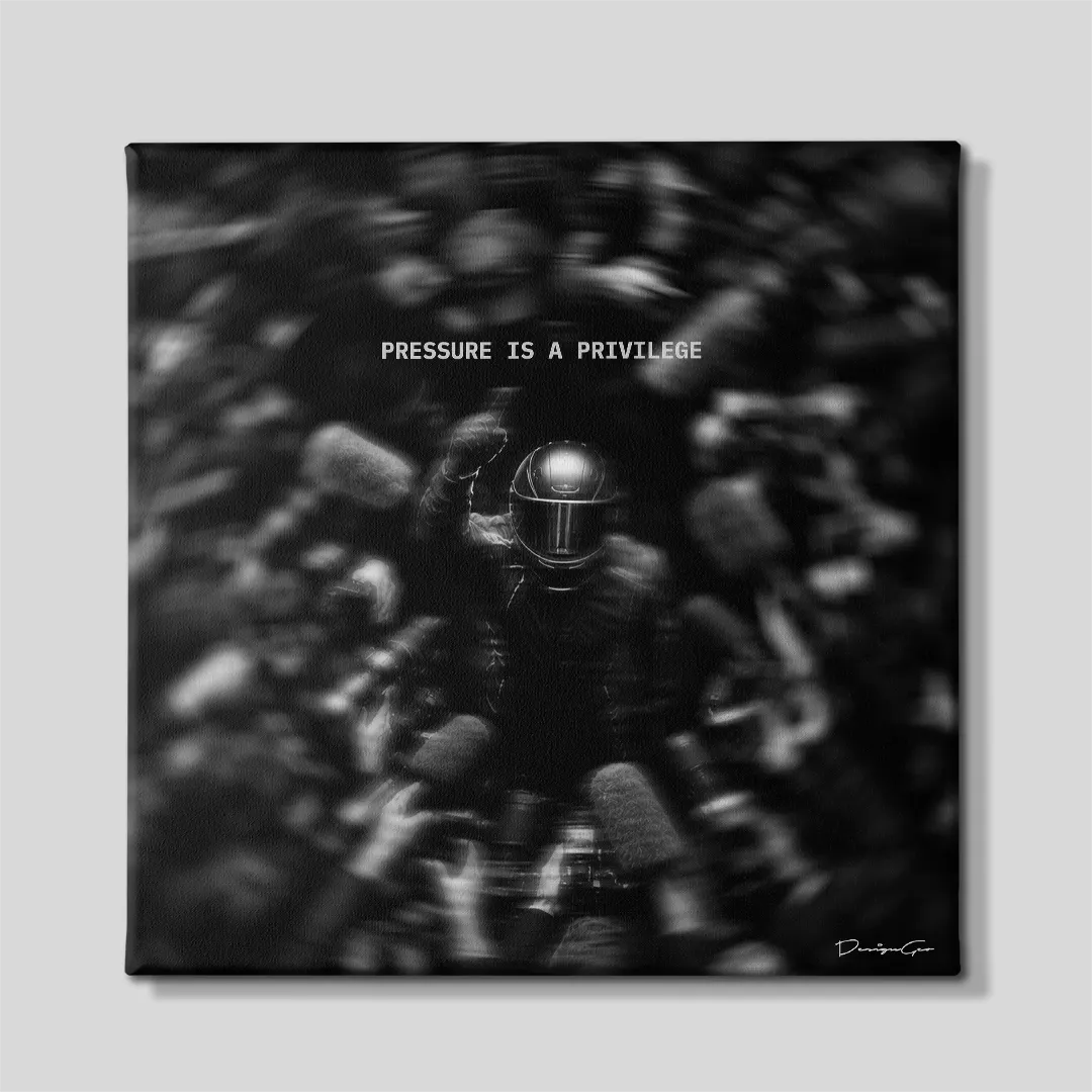 Black and white square motivational canvas wall art featuring a racing driver in helmet raising a fist surrounded by media cameras and microphones under quote Pressure Is A Privilege 0.75 inch thin wrap