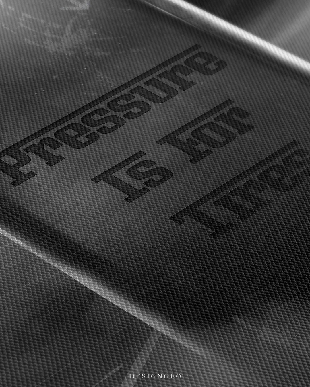 Angled macro view detailing fine woven canvas fabric texture, subtle tire rubber scuffs, and dark stencil lettering of the quote Pressure Is For Tires