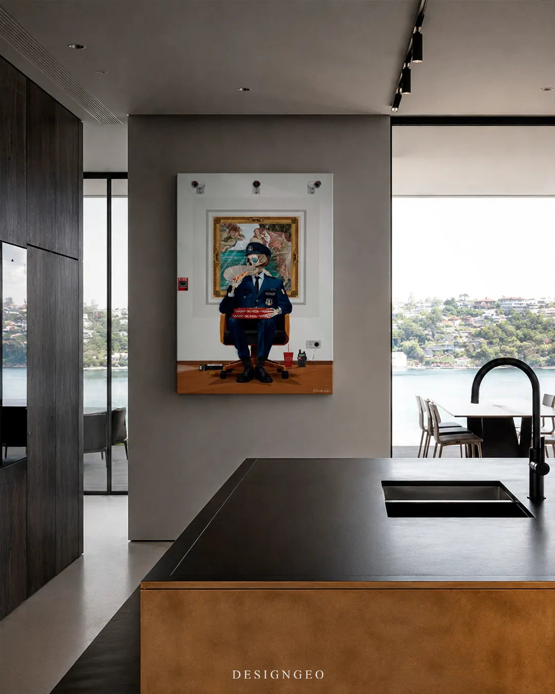 Vertical skeleton security guard eating pizza canvas wall art mounted on a beige wall in a modern kitchen with dark marble countertops and sea views
