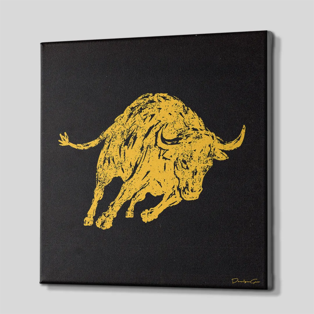 Three-quarter side angle of the square charging yellow bull canvas wall art, showing clean black gallery-wrapped edges mounted on a wooden frame
