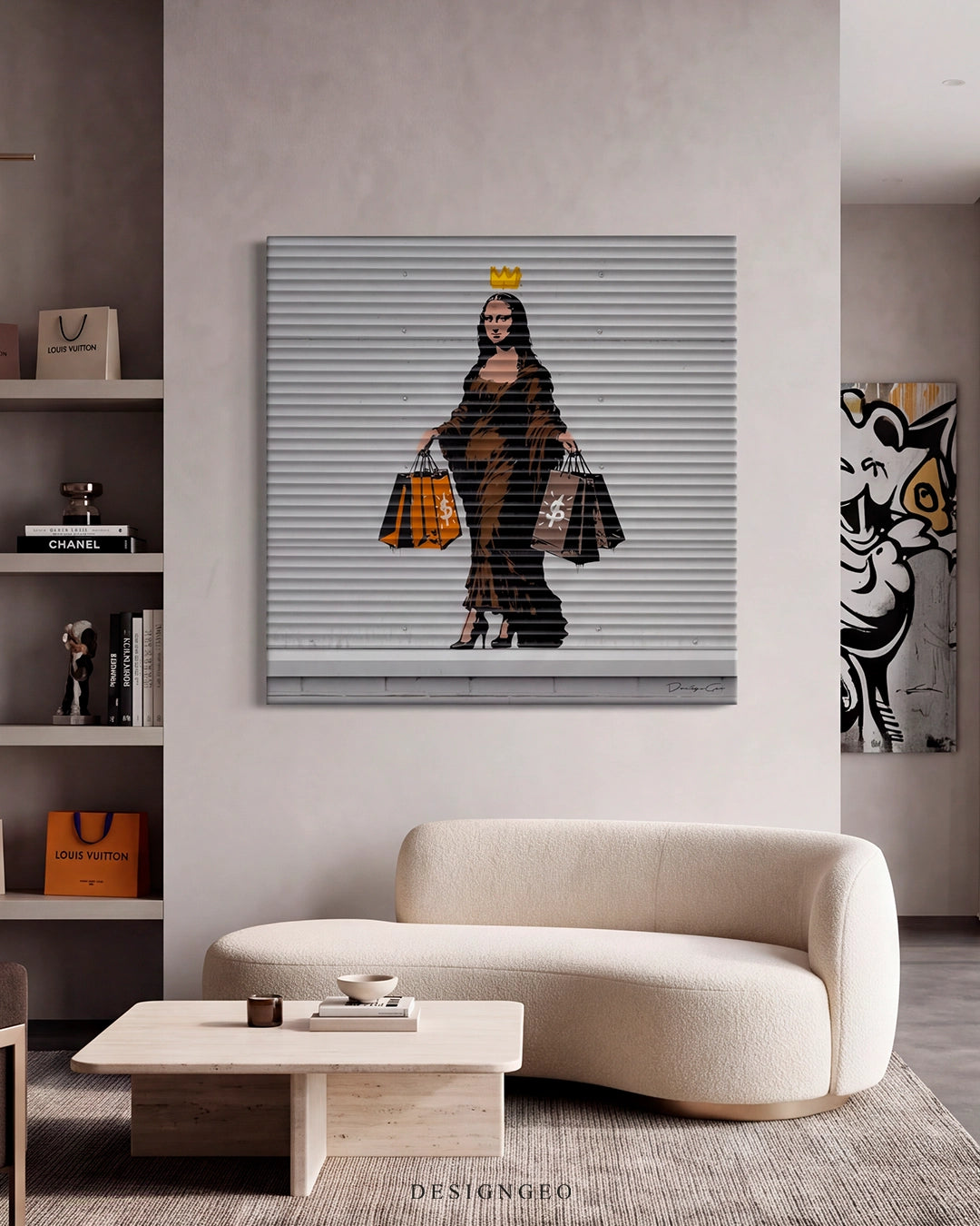 Modern chic living room interior featuring the square "Shopping Queen" graffiti canvas print hanging on a neutral wall above a curved cream sofa, next to shelves with luxury fashion books