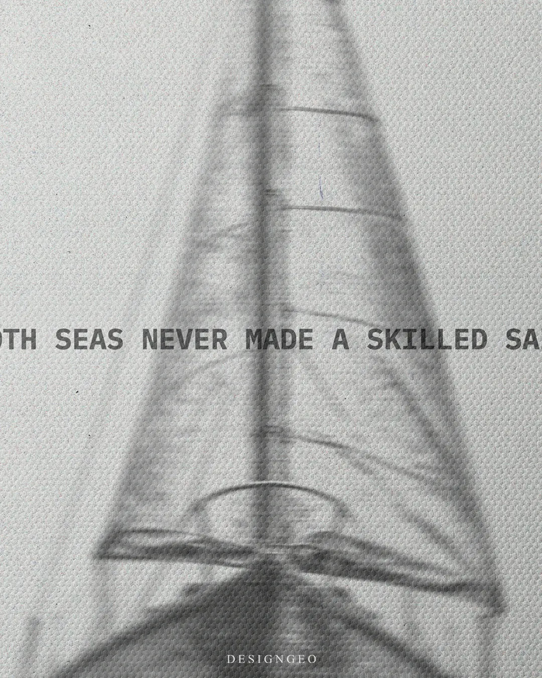 Close up detail of Smooth Seas Never Made A Skilled Sailor typography printed across a black and white sailboat canvas wall art 0.75 inch thin wrap