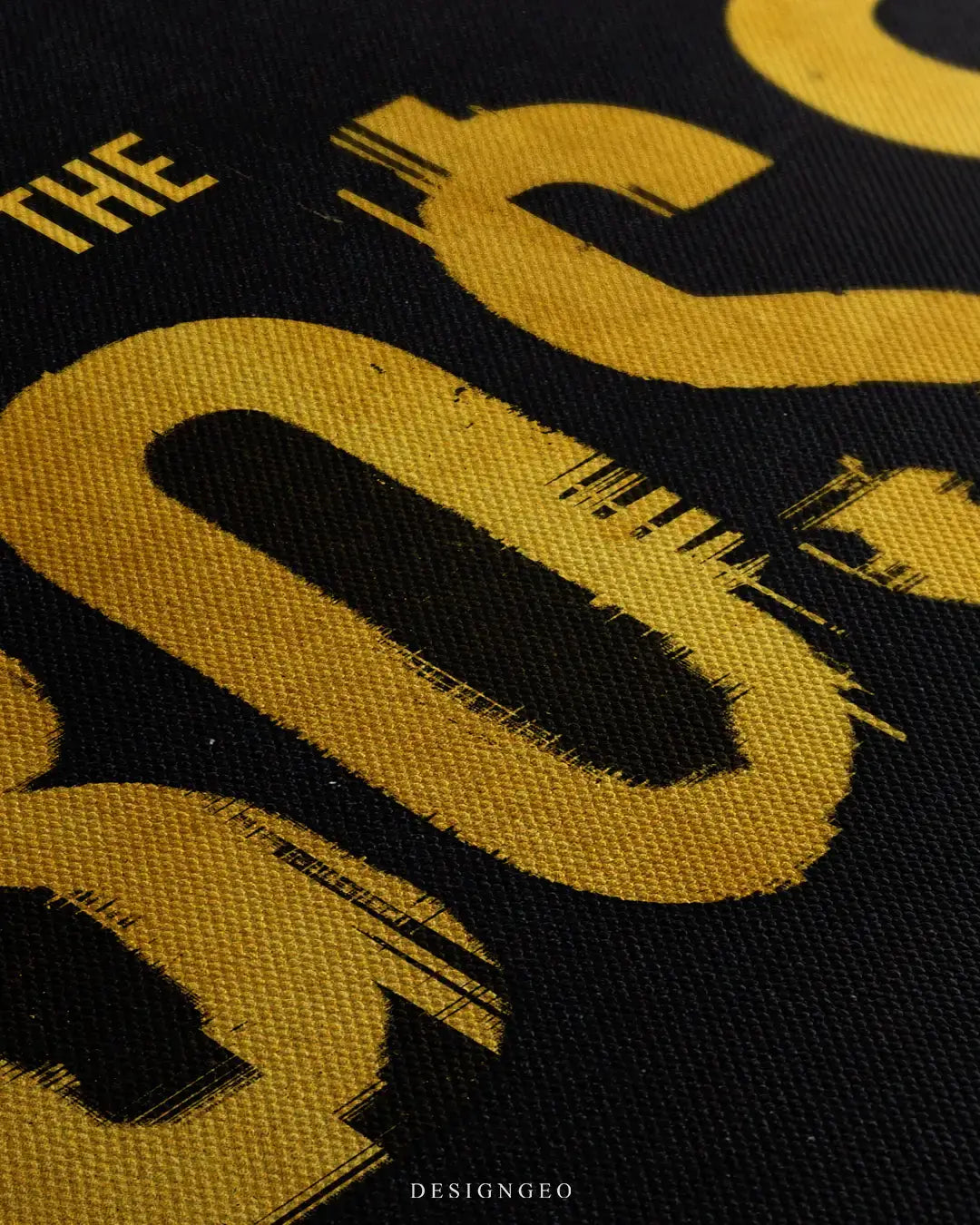 Close-up of modern executive wall art featuring the motivational phrase "THE BOSS" in metallic gold typography over a sleek dark background