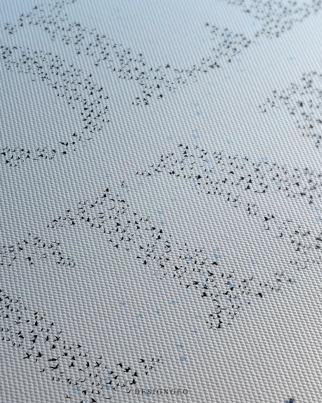 Angled macro view of the canvas print, highlighting the detailed flock of birds forming the words "GOLF" and "TIME" against a soft blue sky backdrop