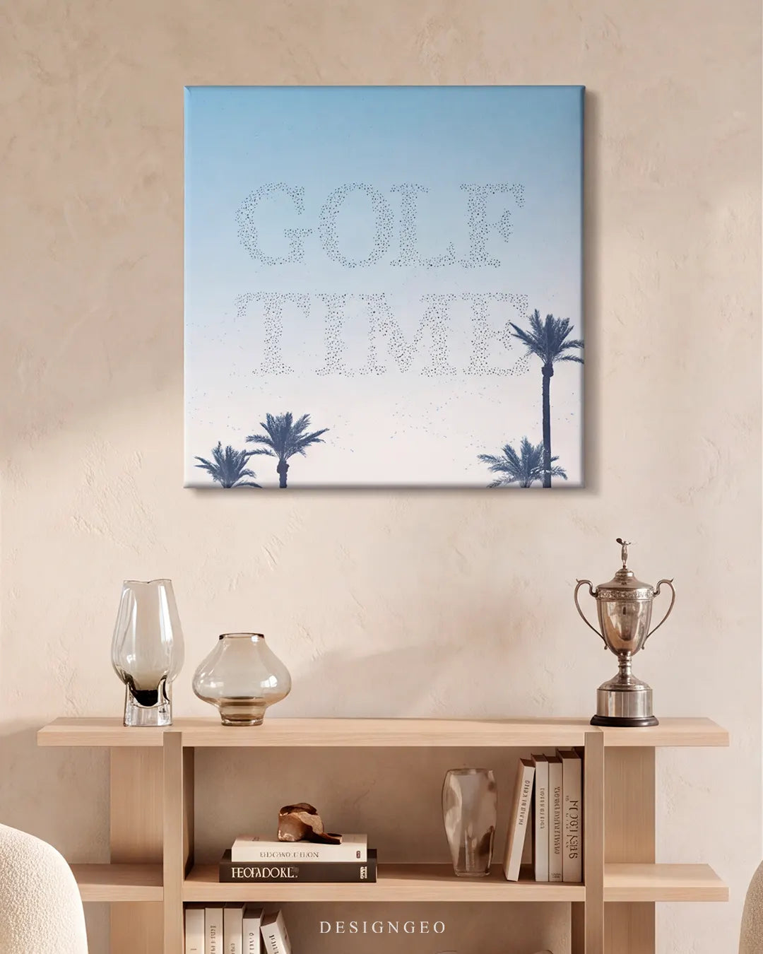 Modern luxury living room featuring the square "GOLF TIME" canvas print mounted above a beige wooden console shelf with a silver golf trophy decor