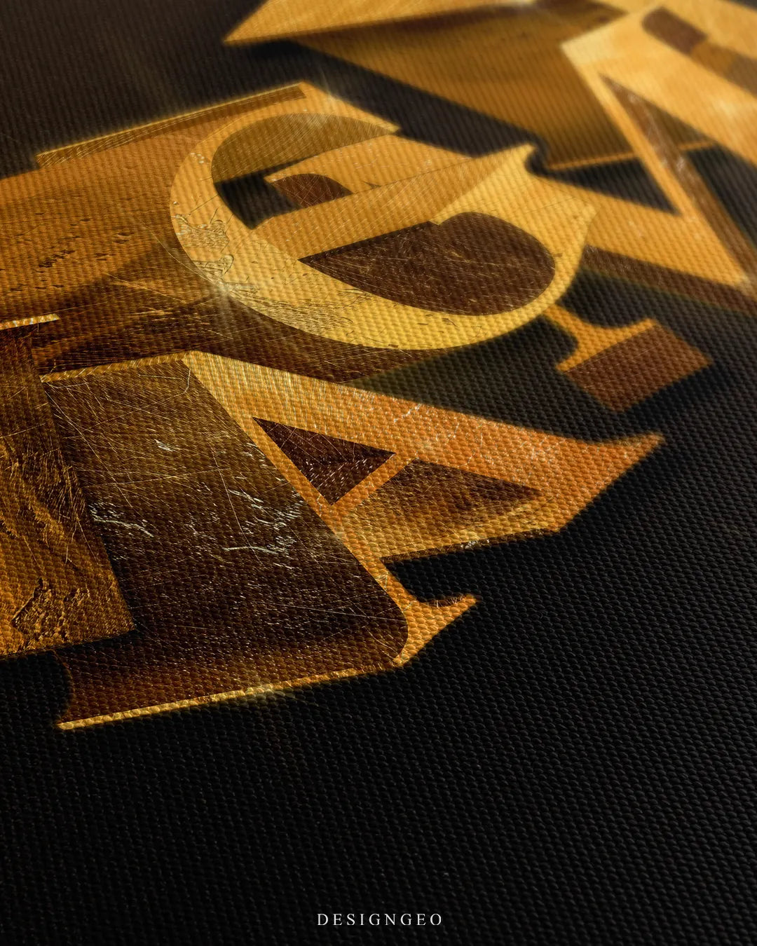 Angled extreme macro view highlighting the woven canvas surface texture, golden light reflections, and layered 3D block lettering geometry