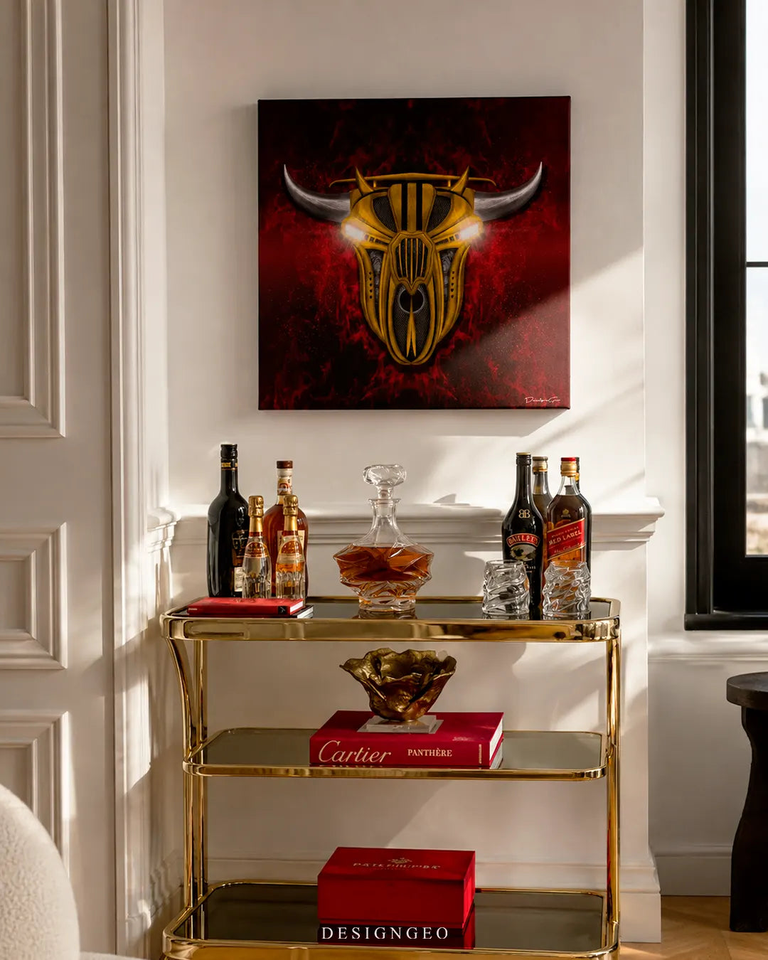 Square yellow mechanical bull canvas print mounted on a white wall above a gold bar cart with whiskey decanters, crystal glasses, and luxury Cartier books